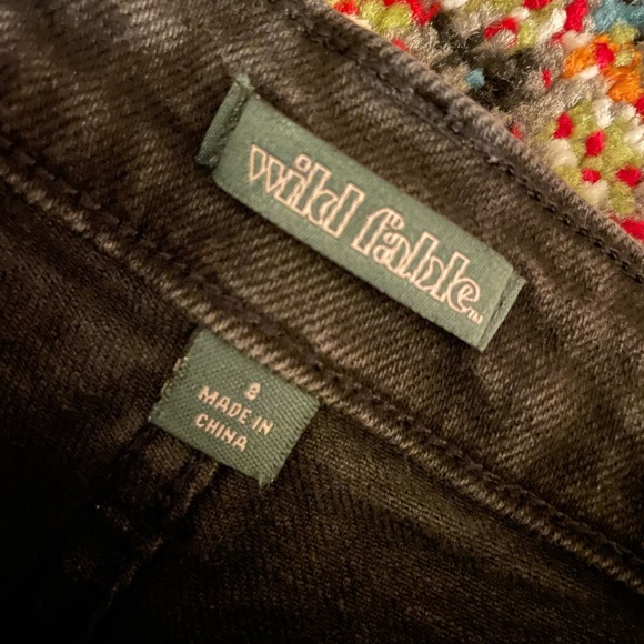 Womens black jeans with holes in the knees and fringed at the bottom. Size 8. - Picture 2 of 2